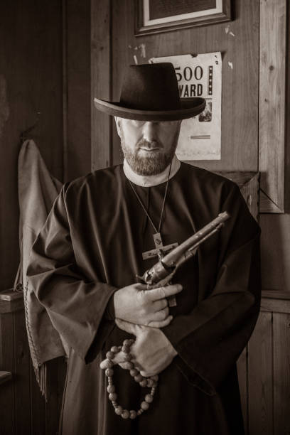 istock Handsome redhead Cowboy priest in an authentic wild west setting 1408419923