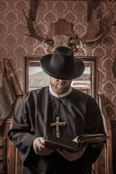istock Handsome redhead Cowboy priest in an authentic wild west setting 1408420068