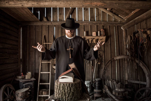 istock Handsome redhead Cowboy priest in an authentic wild west setting 1408420150