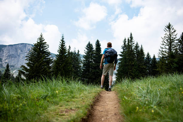 istock Young man hiking at mountain 1408424249