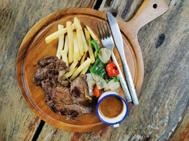 Beef steak in a wooden tray
