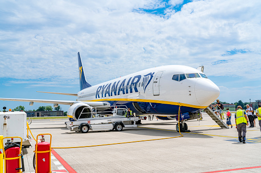 Treviso, Italy - July 7, 2022. Group of passengers boarding Ryanair Boeing 737-800 at Treviso Airport - International Airport Treviso A. Canova (TSF), Italy
