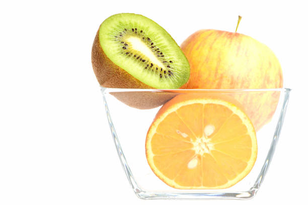 Close-up of fruits on the table and in the background a photographer taking photos indoors