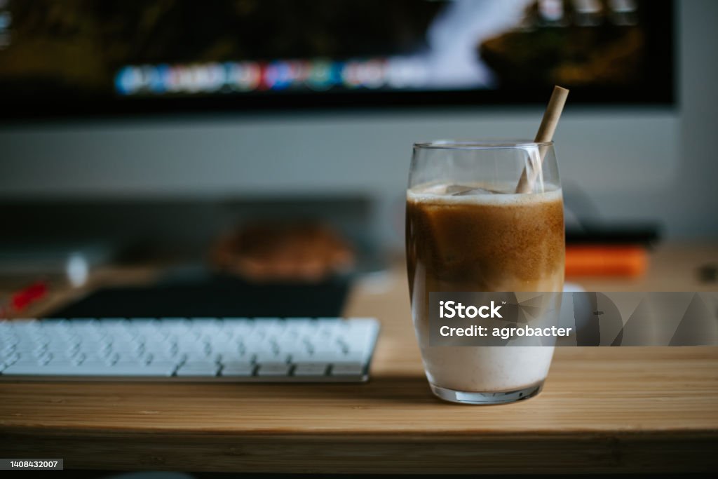 Iced latte on wooden table Cafe Stock Photo