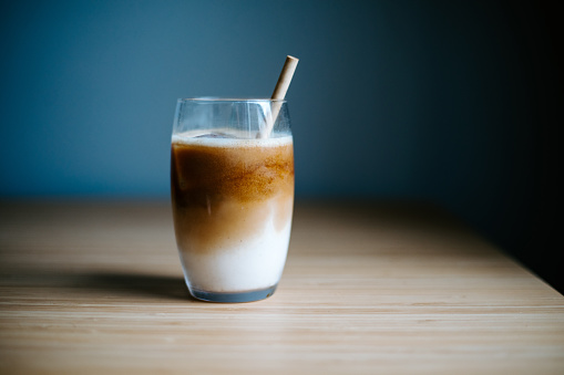 Iced latte on wooden table