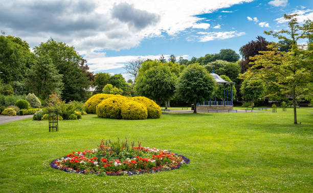 View of Bath Gardens, Bakewell, UK People an be seen  sitting in the gardens