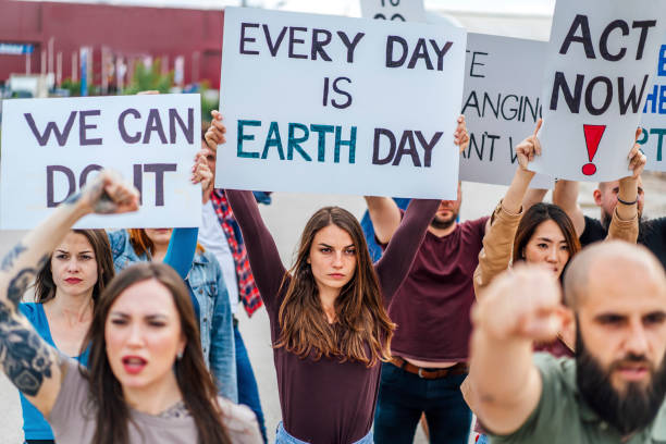 istock Group of people marching against climate change 1408442148