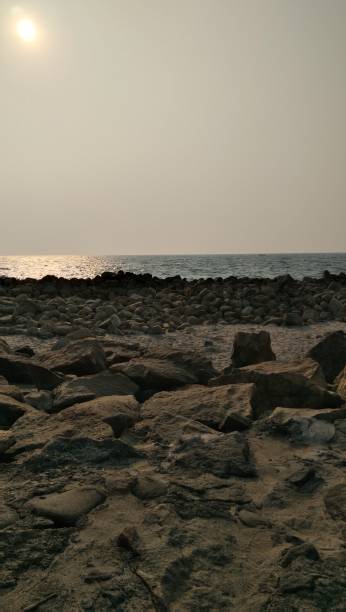 istock Rocky beach shore under the bright sun. 1408442594