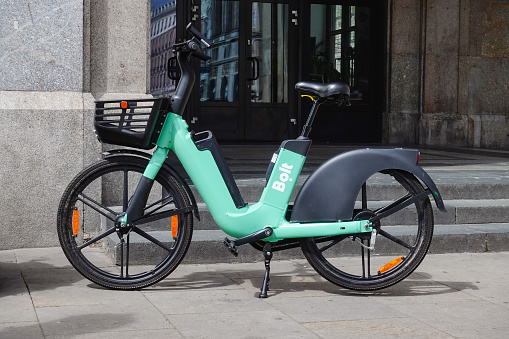 Warsaw, Poland - 10 July, 2022: Electric bike in Bolt bike sharing parked on a street. Zero emission bicycles is the most growth segment of bicycles in the world.