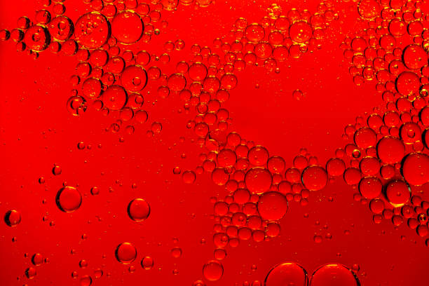 istock Macro drink bubbles,red macro bubbles,Backgrounds, Abstract Backgrounds, Soda, Red, Carbonated,Beauty concept background. Closeup cosmetic liquid gel with bubbles on red colors background 1408446756