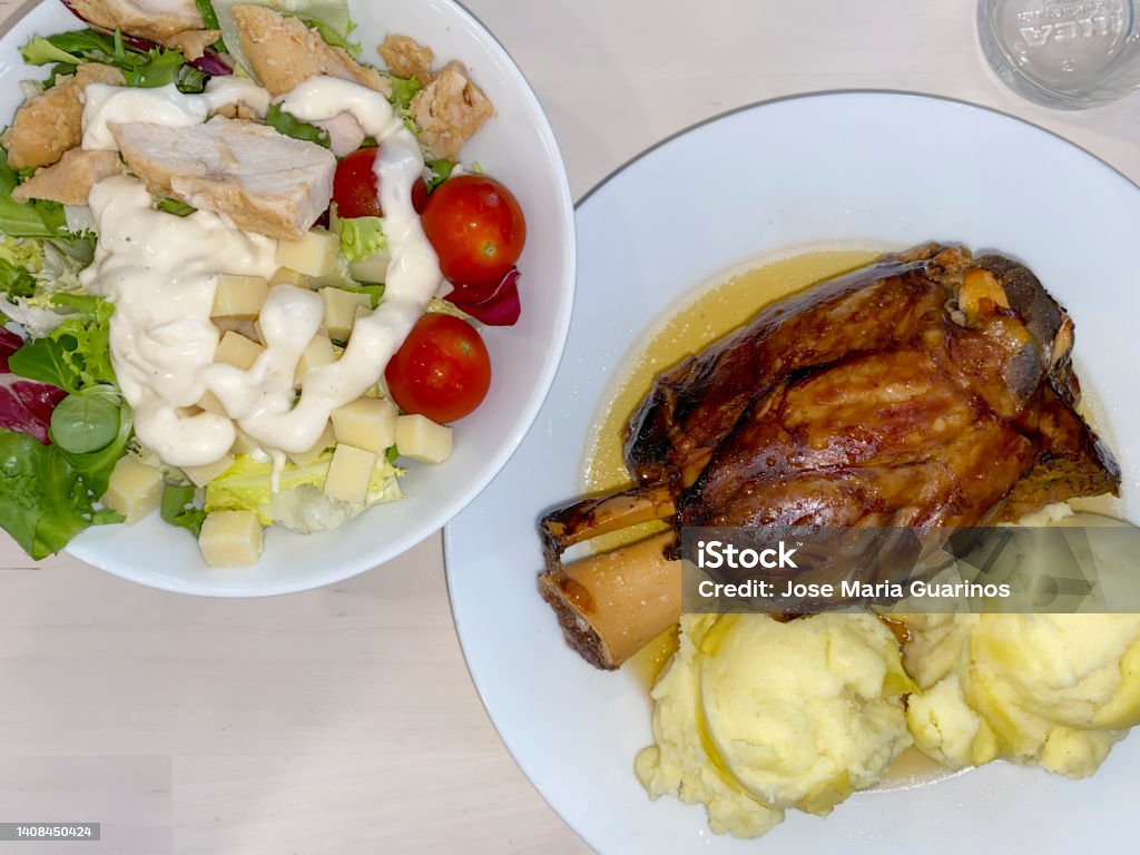 Roast pork knuckle with mashed potatoes from IKEA Roast pork knuckle with mashed potato and fresh salad from IKEA Appetizer Stock Photo