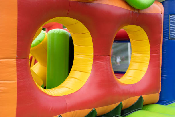 istock Inflatable construction in amusement park. Obstacle course for children. 1408450428