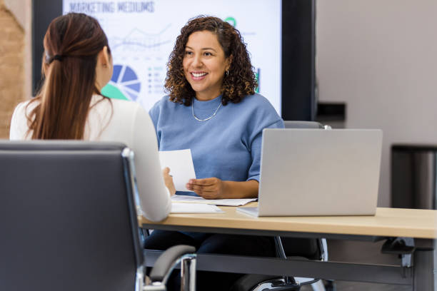 istock Female manager meets with unrecognizable employee for performance review 1408450496