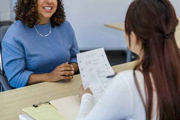istock Unrecognizable manager asks woman questions about resume 1408450664