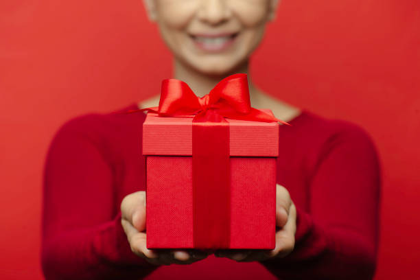 Woman Holding Gift Box stock photo