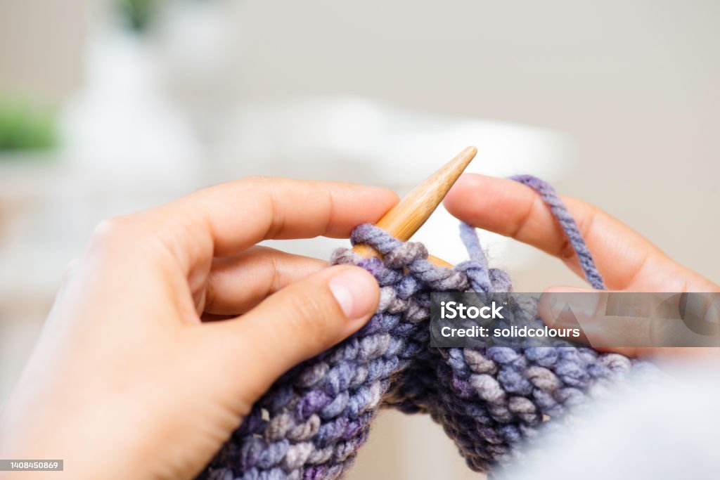 Woman's Hands Knitting Close up on woman's hands knitting. Adult Stock Photo