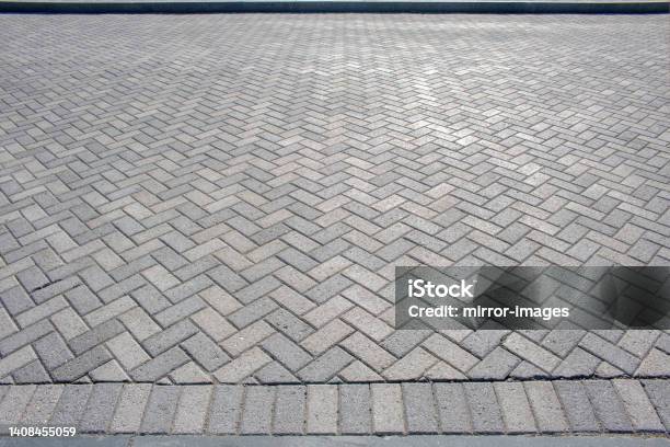 White And Grey Harring Patterned Brick Floor Pavement Outdoors Stock Photo - Download Image Now