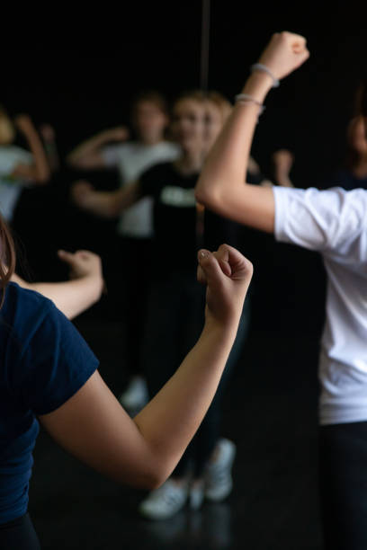 istock Young people dancing in a dark room 1408455737