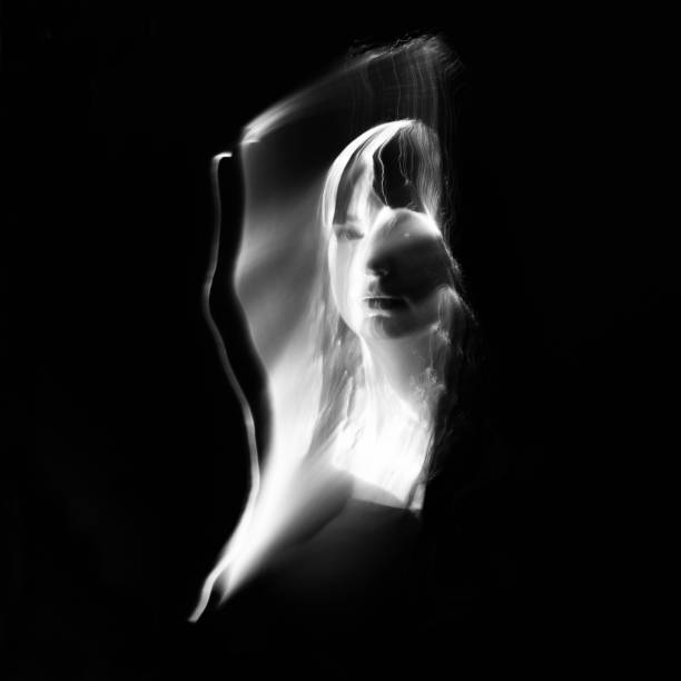 istock Abstract human silhouette in light trails of light painting 1408456914