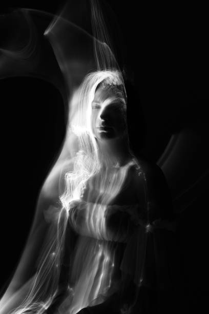 istock Abstract human silhouette in light trails of light painting 1408456920