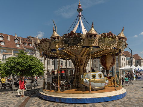 A classic and colorful carousel in Besancon, Francebesancon, france-may 07, 2022: