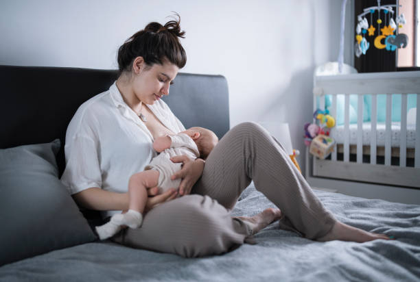 istock Caucasian mother breast feeding baby boy. 1408460033