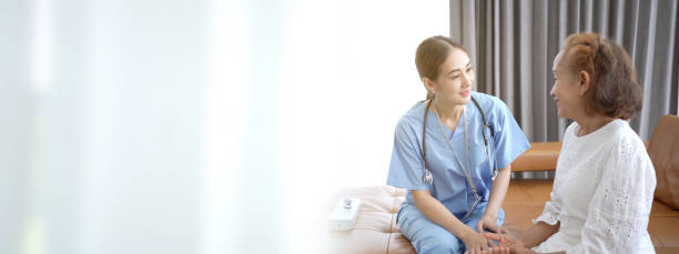 Doctor talking to patient. stock photo
