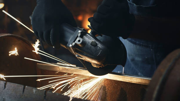 istock Metalworking with circular saw in garage 1408461160