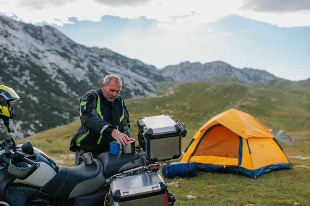 istock Biker unpacking his panniers 1408462125