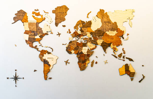 istock World map of earth showing continents on a wood tree ring texture background on white 1408463678