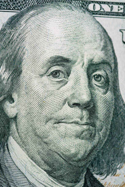 istock Close up of new hundred dollar bill. 1408465501