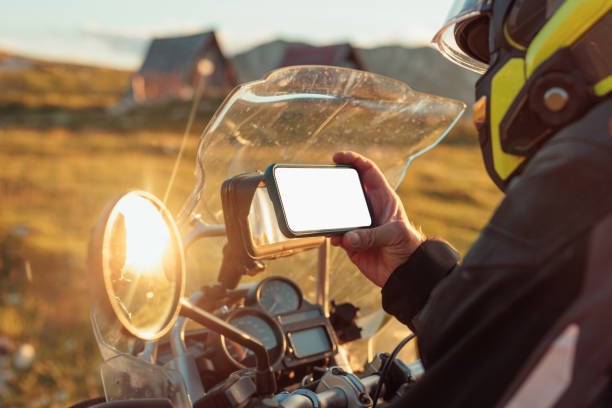 istock Motorcyclist adjusting the navigation on mobile phone 1408465797