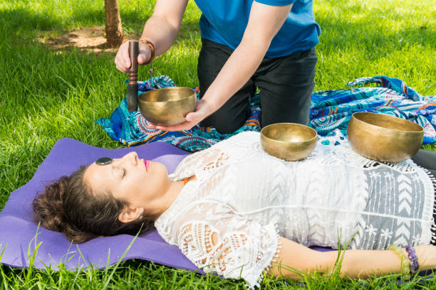 istock Woman during a singing bowl session. 1408466561