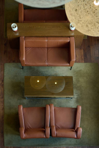 istock Above angle of brown leather sofa and two armchairs surrounding table 1408468530