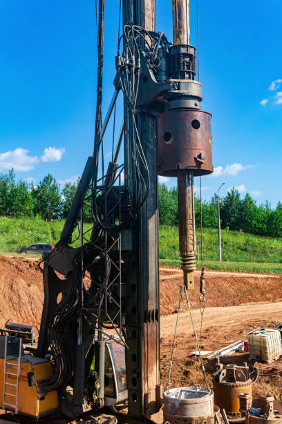 istock machine for drilling deep piles is preparing to work on the construction of the bridge 1408468754
