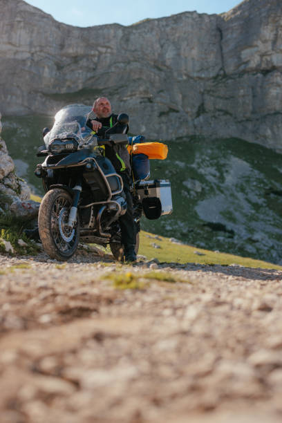 istock Motorcycle rider on journey in mountains 1408470047
