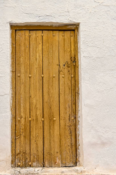 istock An old and weathered wooden door. 1408471756