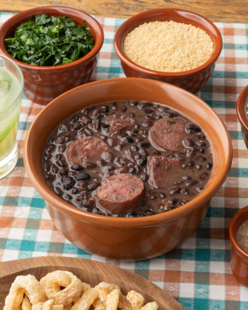 istock Typical brazilian feijoada with rice, caipirinha, farofa and cracklings 1408474277