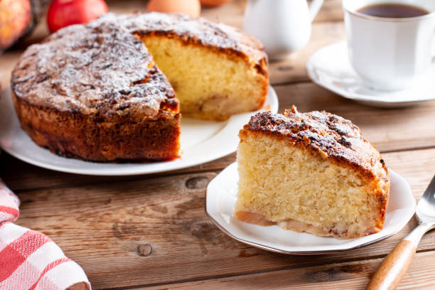 istock Sponge cake with apples on a table, selective focus. Homemade cake 1408486785