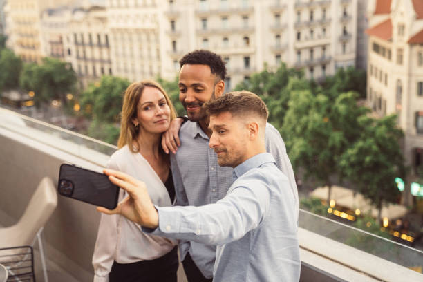 istock Friends talking and taking a selfie in a terrace 1408486818