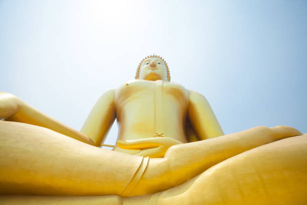 Golden thai buddha statue and landmark   at Wat Muang  in Ang Thong with national landmark 96m high Buddha statue of Thailand  in public free ground outside of city