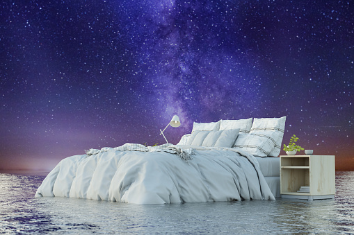 Cozy Bed on Ocean Under Sky Ful of Stars. 3D Render