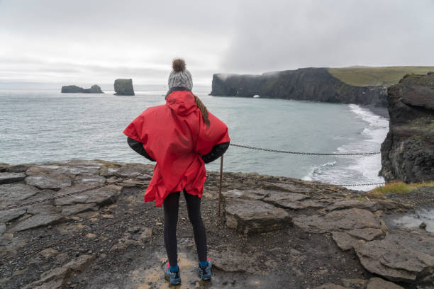 istock Women at Reynisfjara Black Sand Beach 1408494412