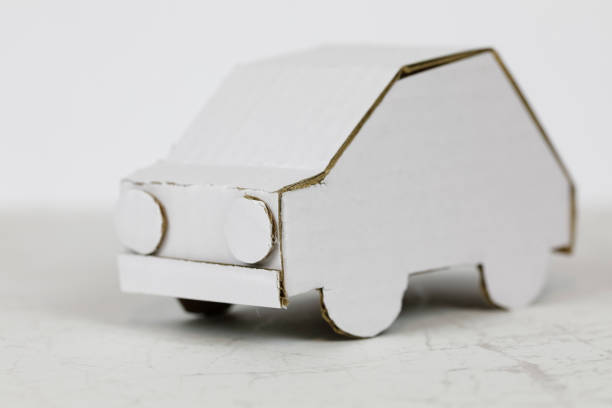 istock Paper car model made of white cardboard 1408494733