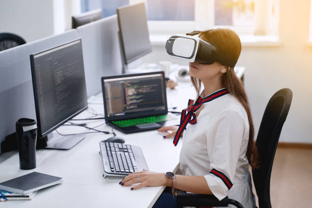 istock Female professional using vr virtual reality headset at desk in office 1408494879