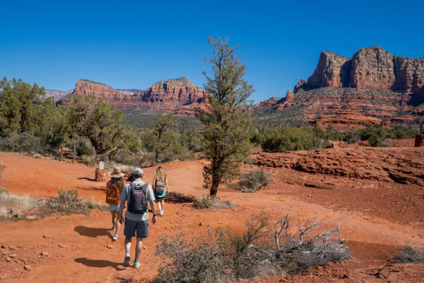 istock Family on spring hiking trip in red mountains. 1408496041