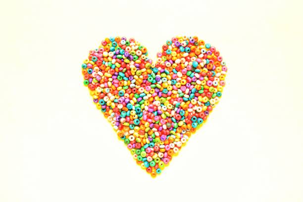 istock Colorful texture painted wooden beads on white background 1408503290