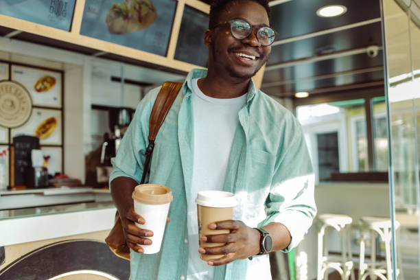 istock Smiling African American man in cafeteria 1408503601