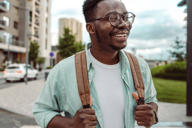istock Smiling African American man wearing a backpack 1408504602