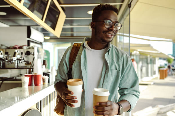 istock Smiling African American man in cafeteria 1408504968